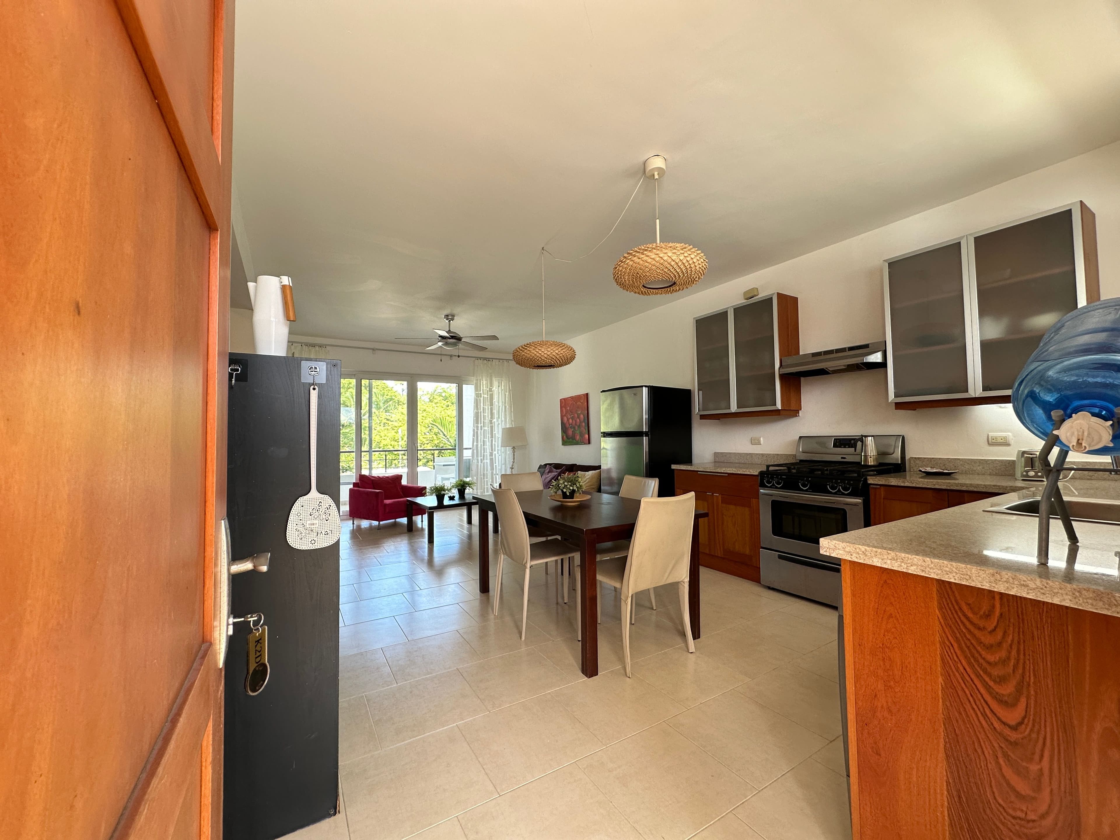 2-Bedroom Furnished Condo in Beachfront Infiniti Blu, Sosúa — Open living & dining area