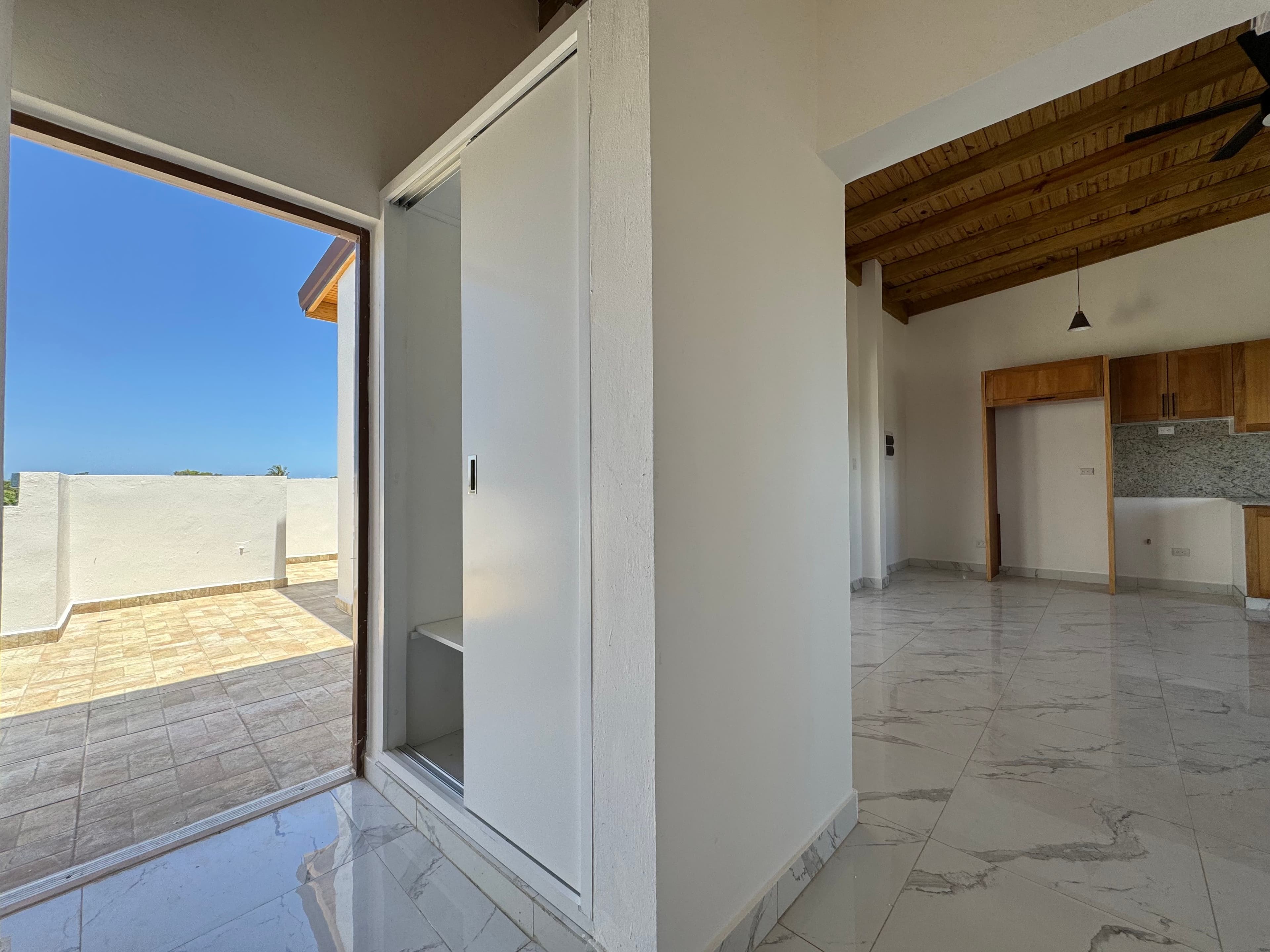 2-Bedroom Apartment with Private Balcony in Sosúa — Open living & dining area