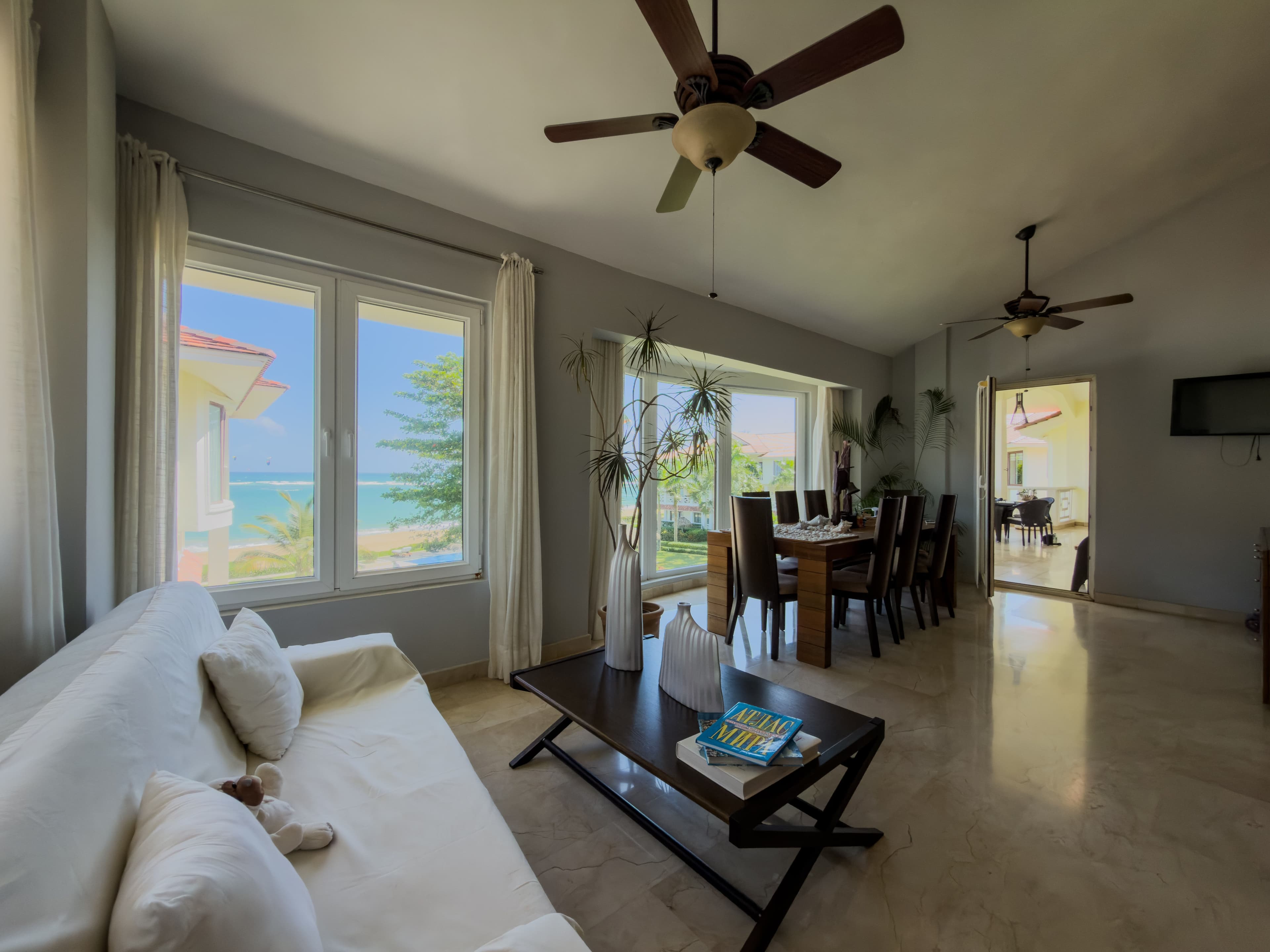 4-Bedroom Beachfront Penthouse with Ocean Terraces in Cabarete — Open living & dining area