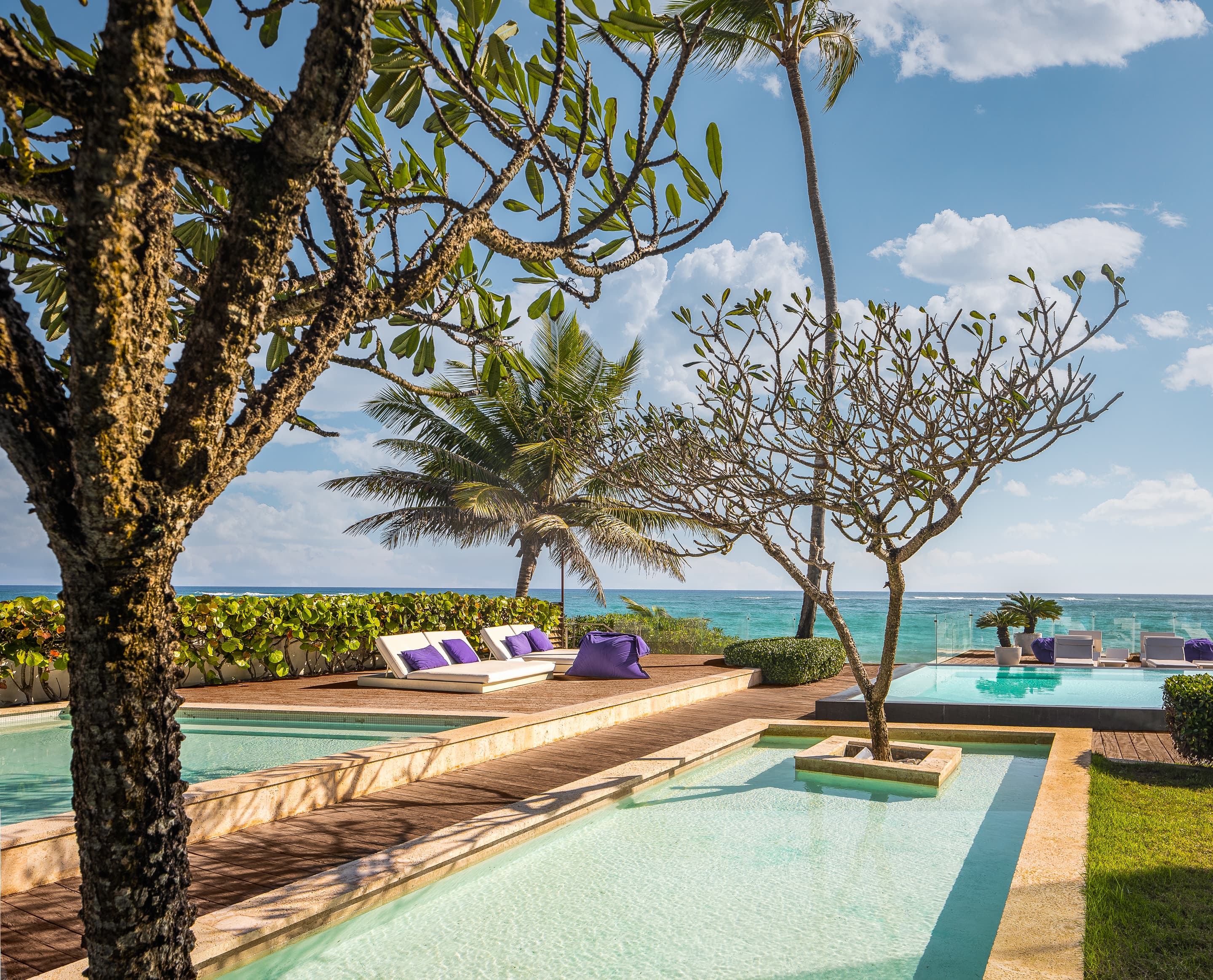 large pool area with trees, overlooking the ocean in Cabarete, Dominican Republic