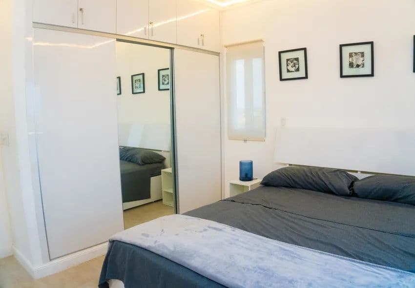 1-Bedroom Furnished Apartment with Ocean View Balcony in Sosúa — Bedroom
