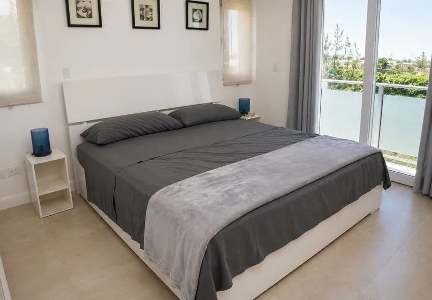 1-Bedroom Furnished Apartment with Ocean View Balcony in Sosúa — Bedroom