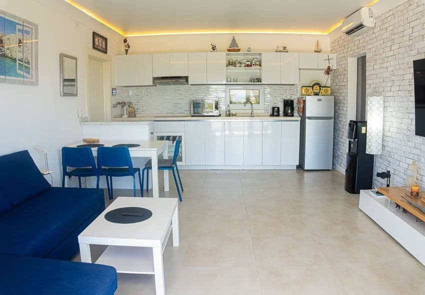 1-Bedroom Furnished Apartment with Ocean View Balcony in Sosúa — Open living & dining area