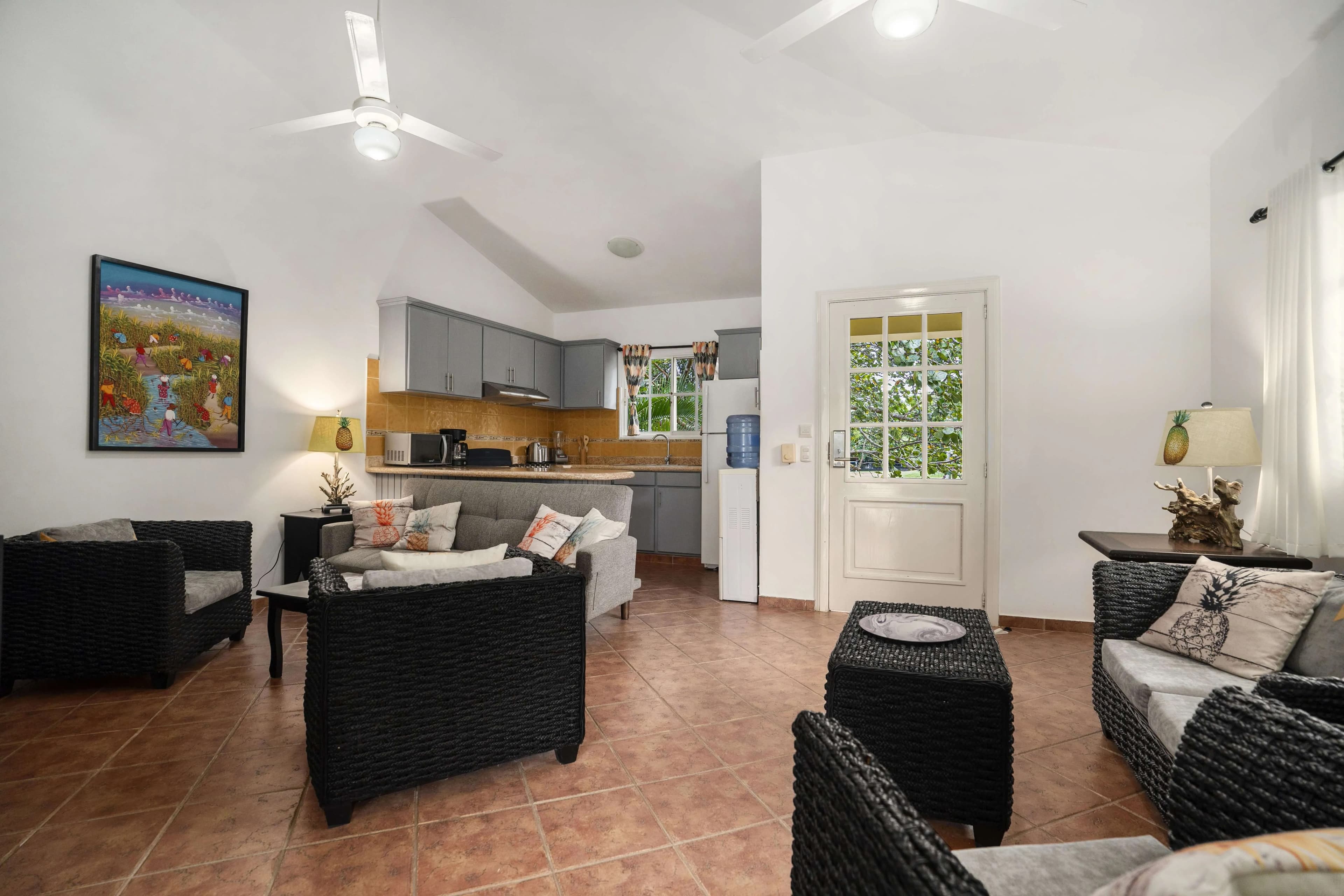 2-Bedroom Expanded Colibri Villa with Pool in Residencial Hispaniola — Open living & dining area