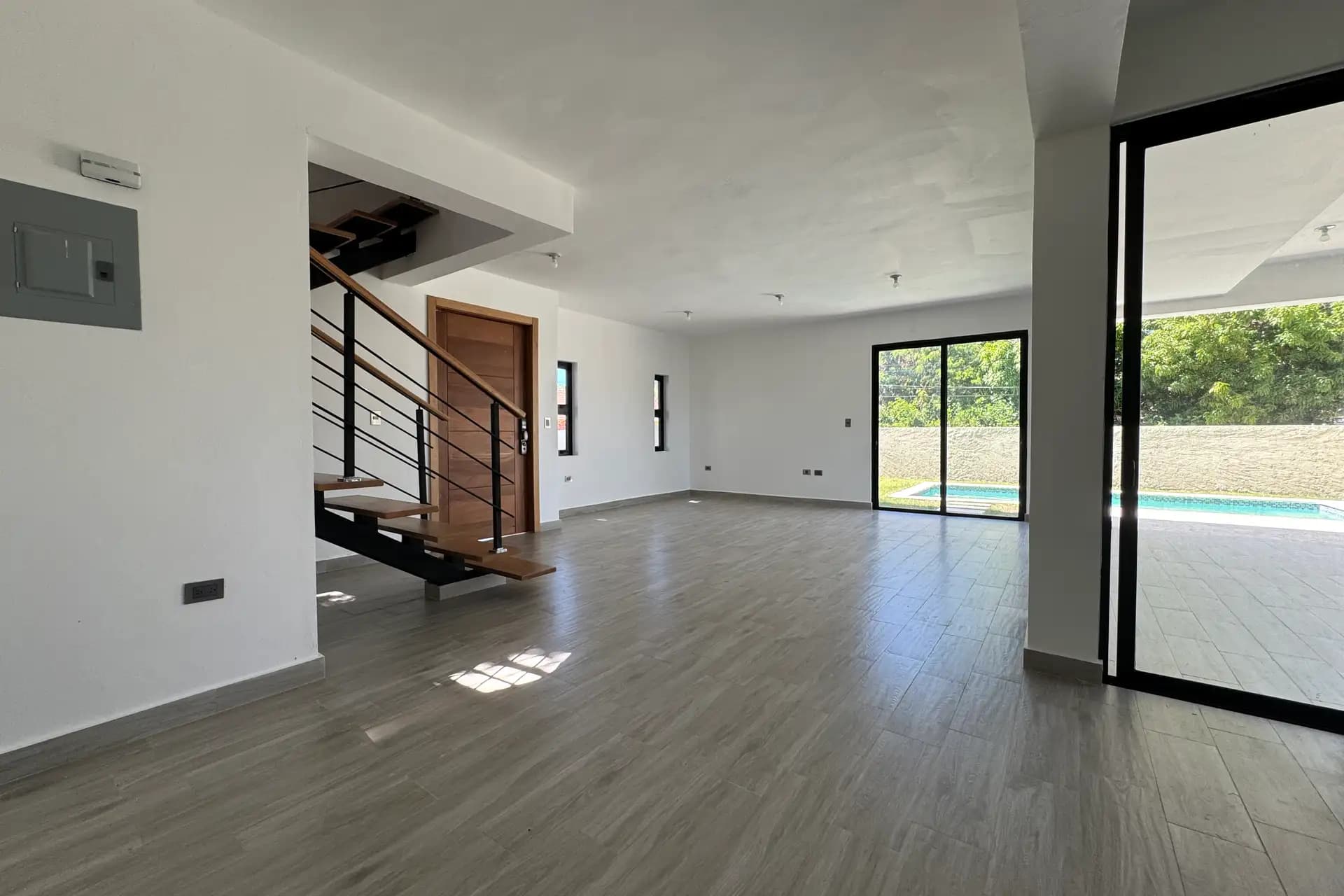 Modern 3-Bedroom Pool Villa in Villas Larimar, Perla Marina — Open living & dining area