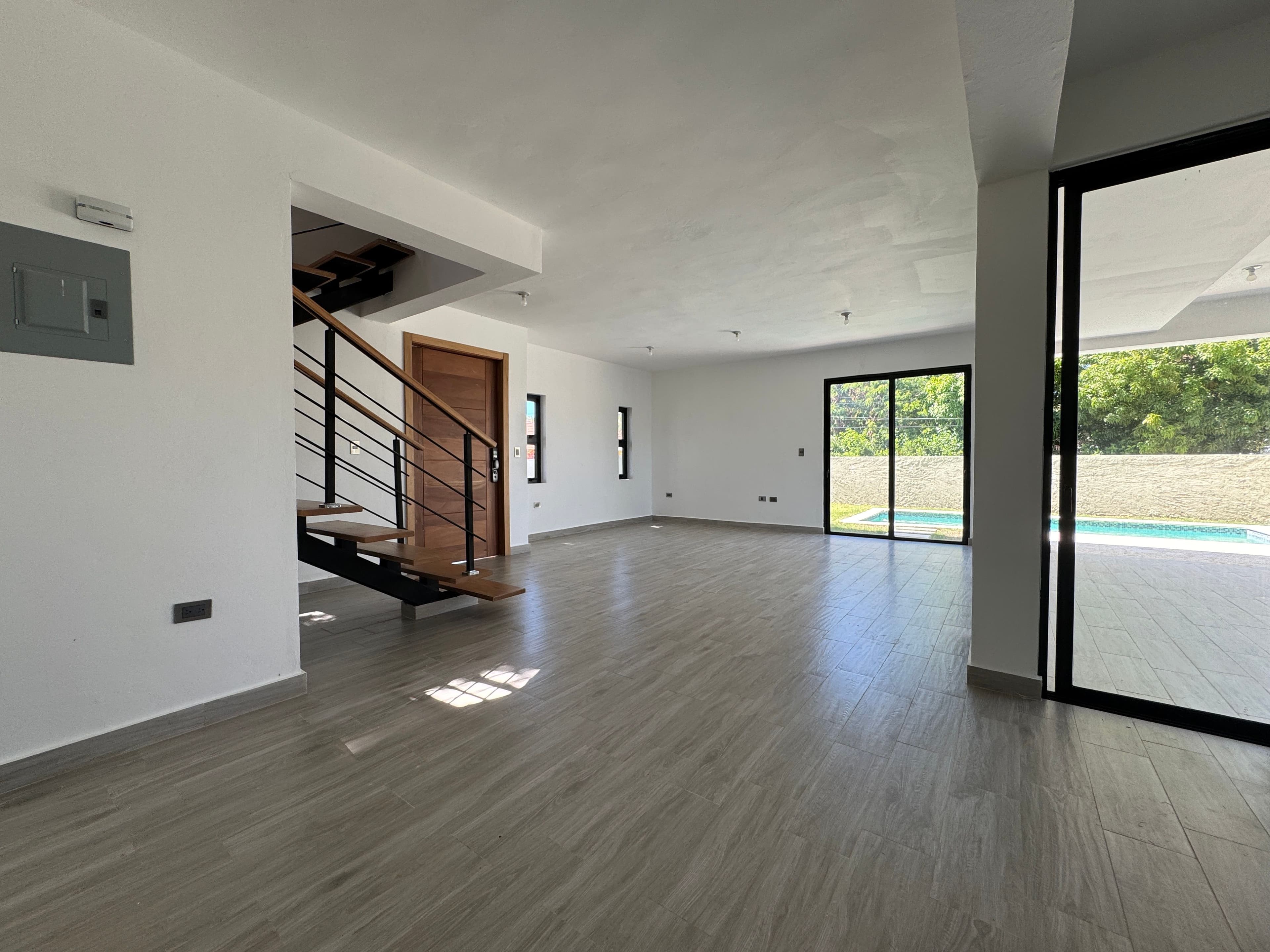 Modern 3-Bedroom Pool Villa in Villas Larimar, Perla Marina — Open living & dining area