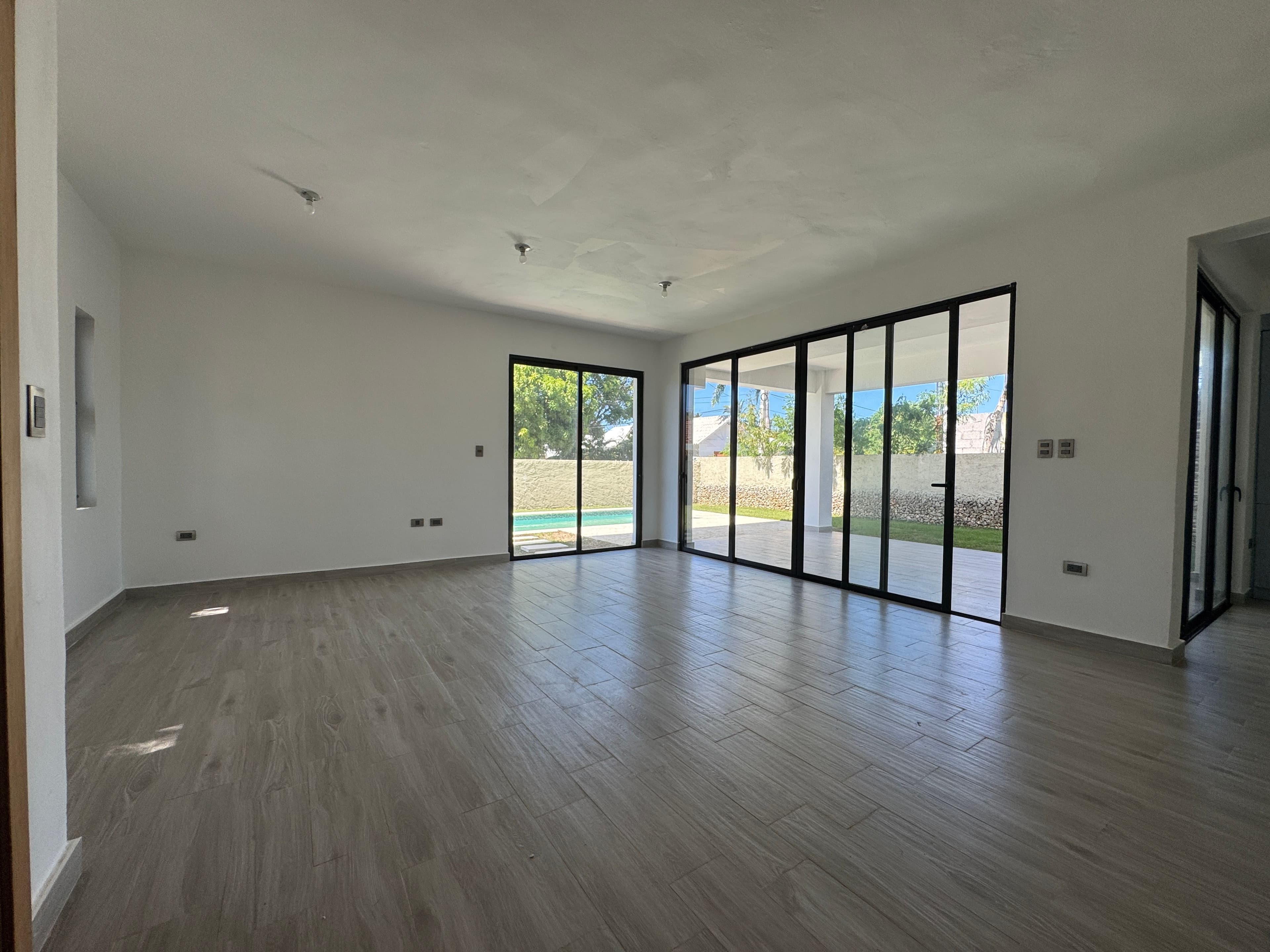Modern 3-Bedroom Pool Villa in Villas Larimar, Perla Marina — Living room