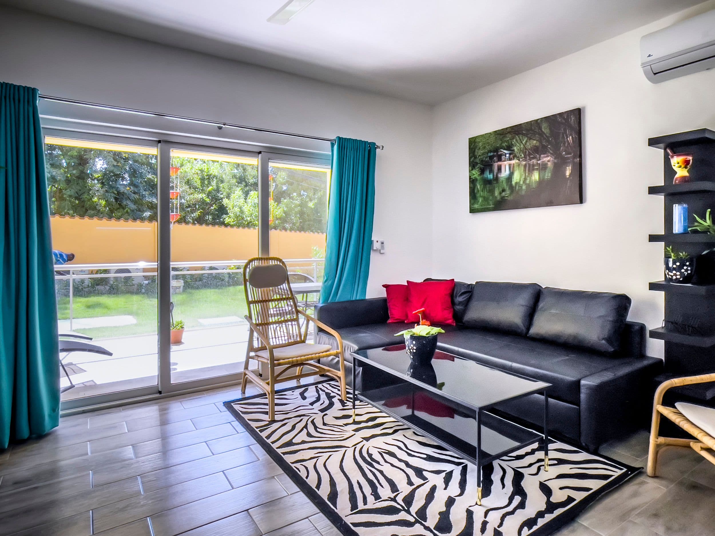 1-Bedroom Furnished Condo near Sosúa Beach in Hill Side Condos — Living room