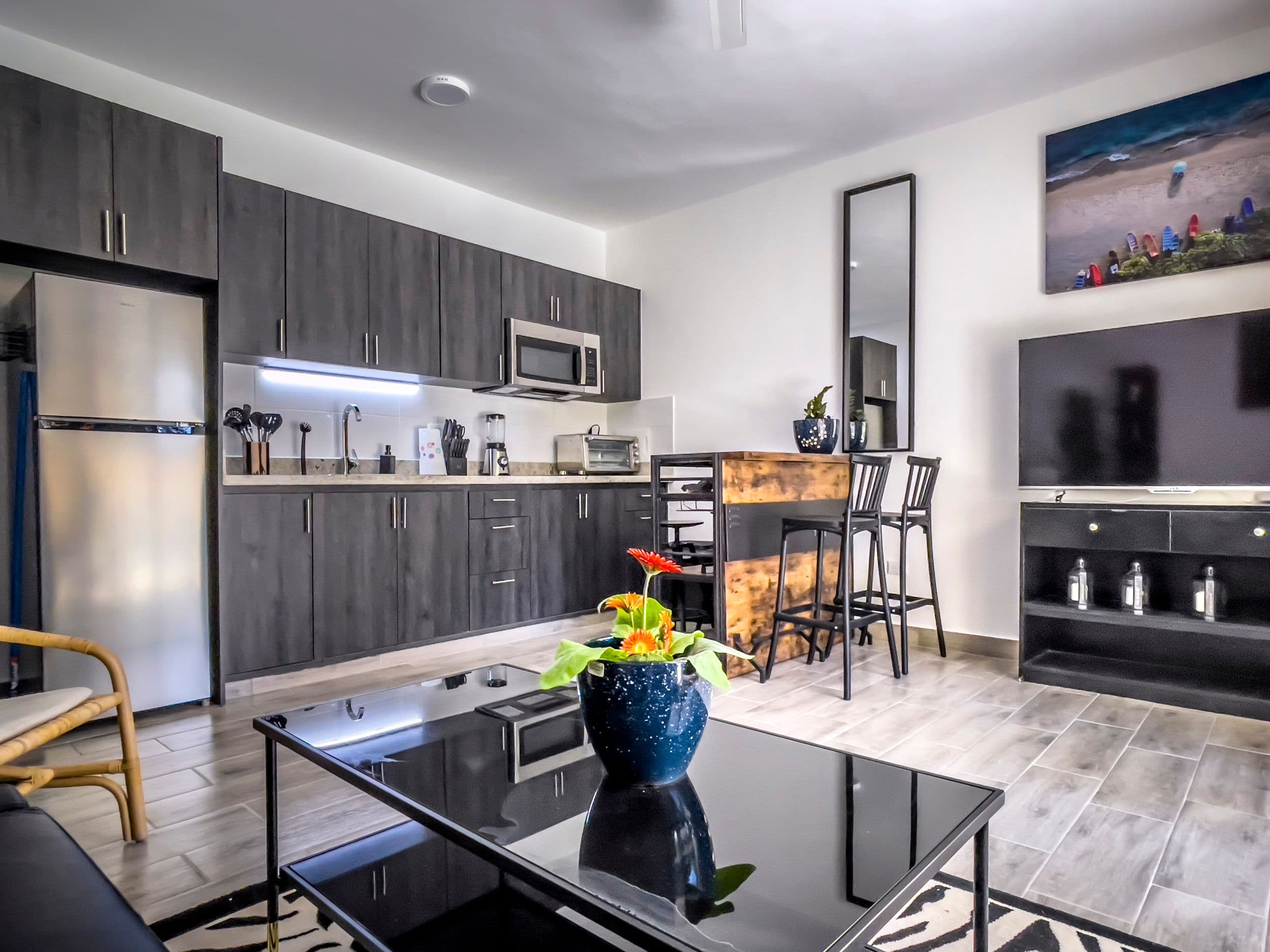 1-Bedroom Furnished Condo near Sosúa Beach in Hill Side Condos — Open living & dining area