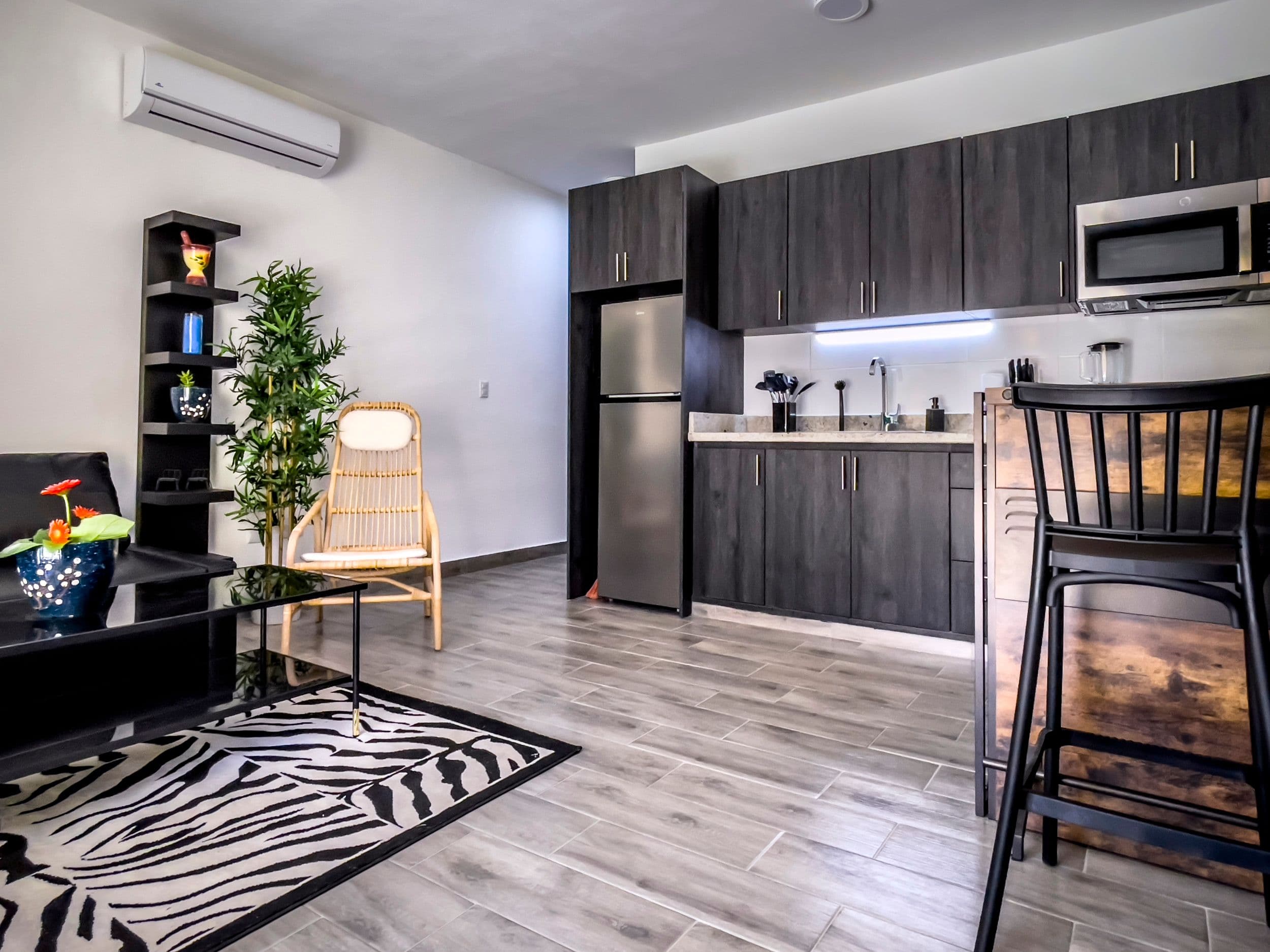 1-Bedroom Furnished Condo near Sosúa Beach in Hill Side Condos — Open living & dining area