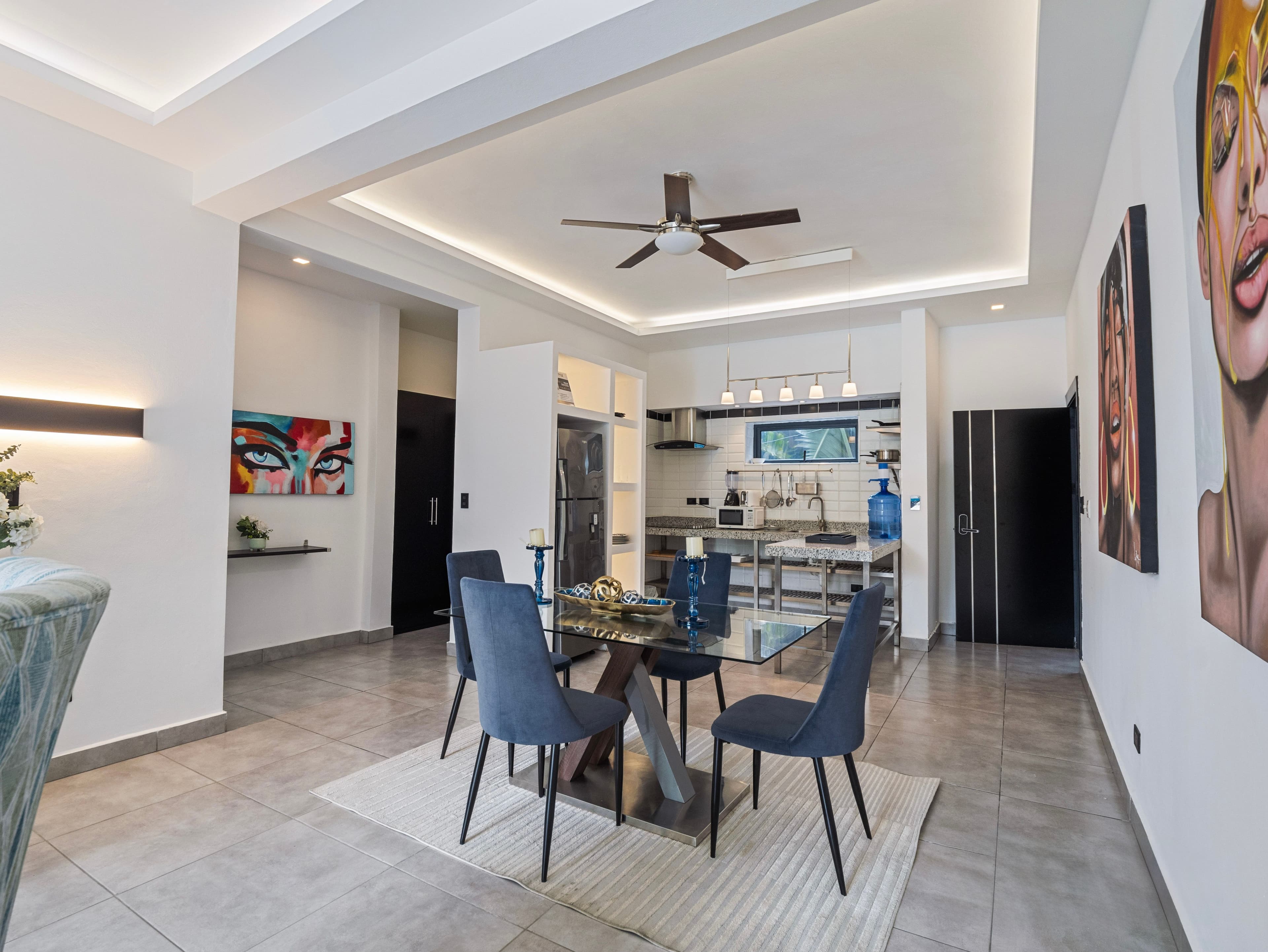 1-Bedroom Deluxe Rental Apartment with Pool and Gym in Sosúa — Open living & dining area