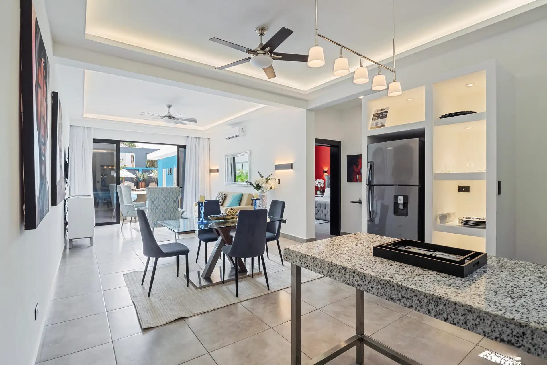 1-Bedroom Deluxe Rental Apartment with Pool and Gym in Sosúa — Open living & dining area