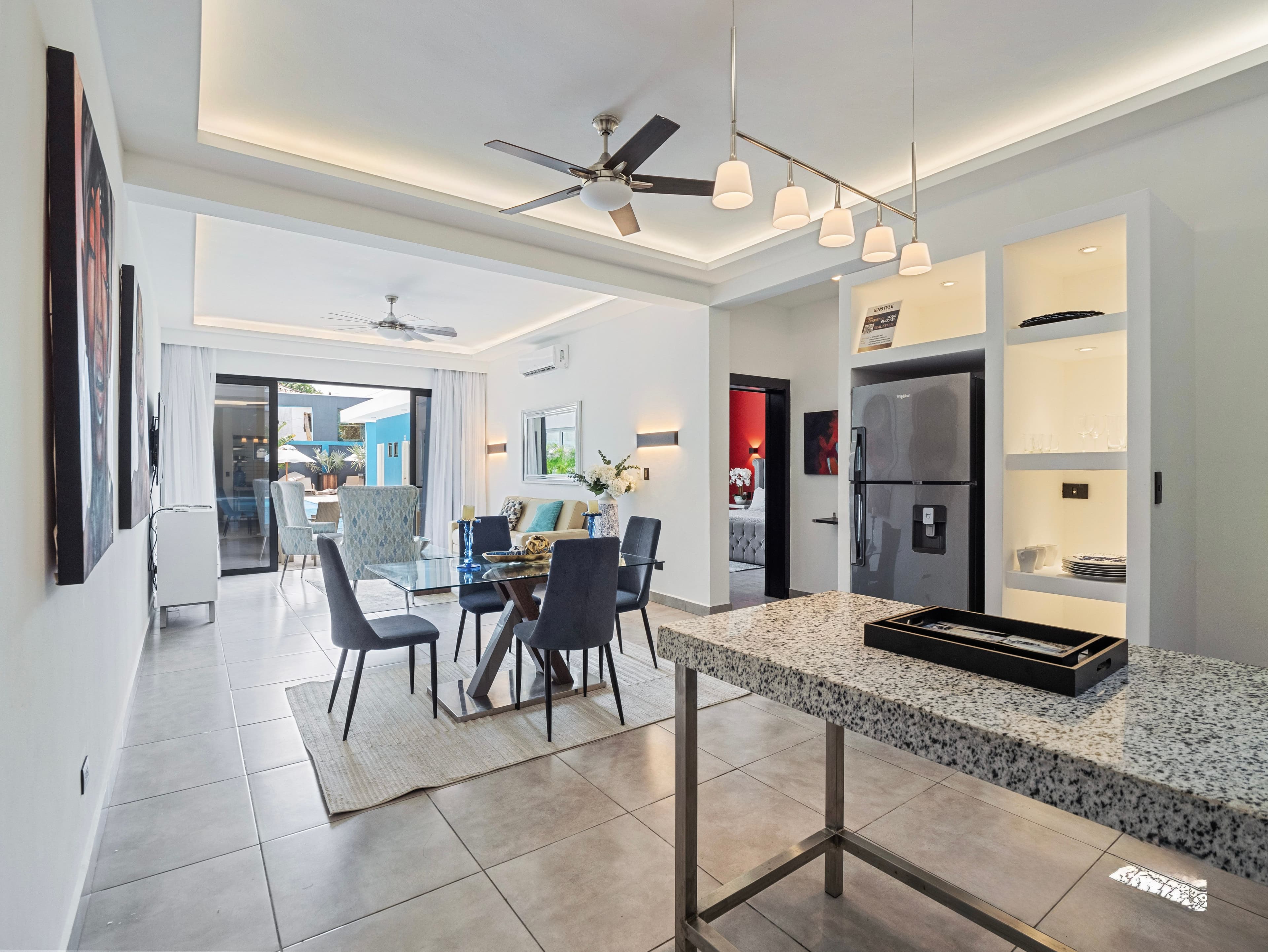 1-Bedroom Deluxe Rental Apartment with Pool and Gym in Sosúa — Open living & dining area