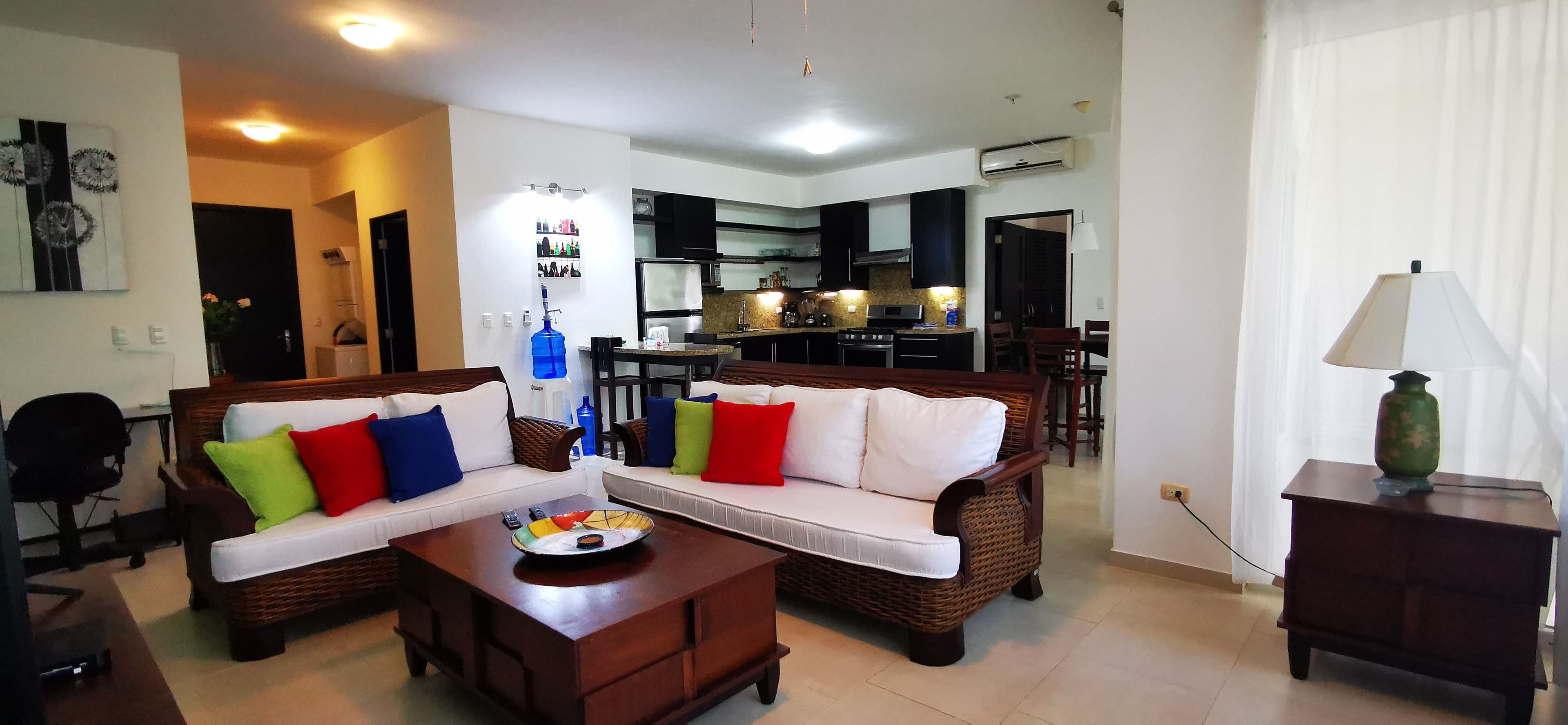 1-Bedroom Beachfront Apartment with Partial Ocean Views in Sosúa — Open living & dining area