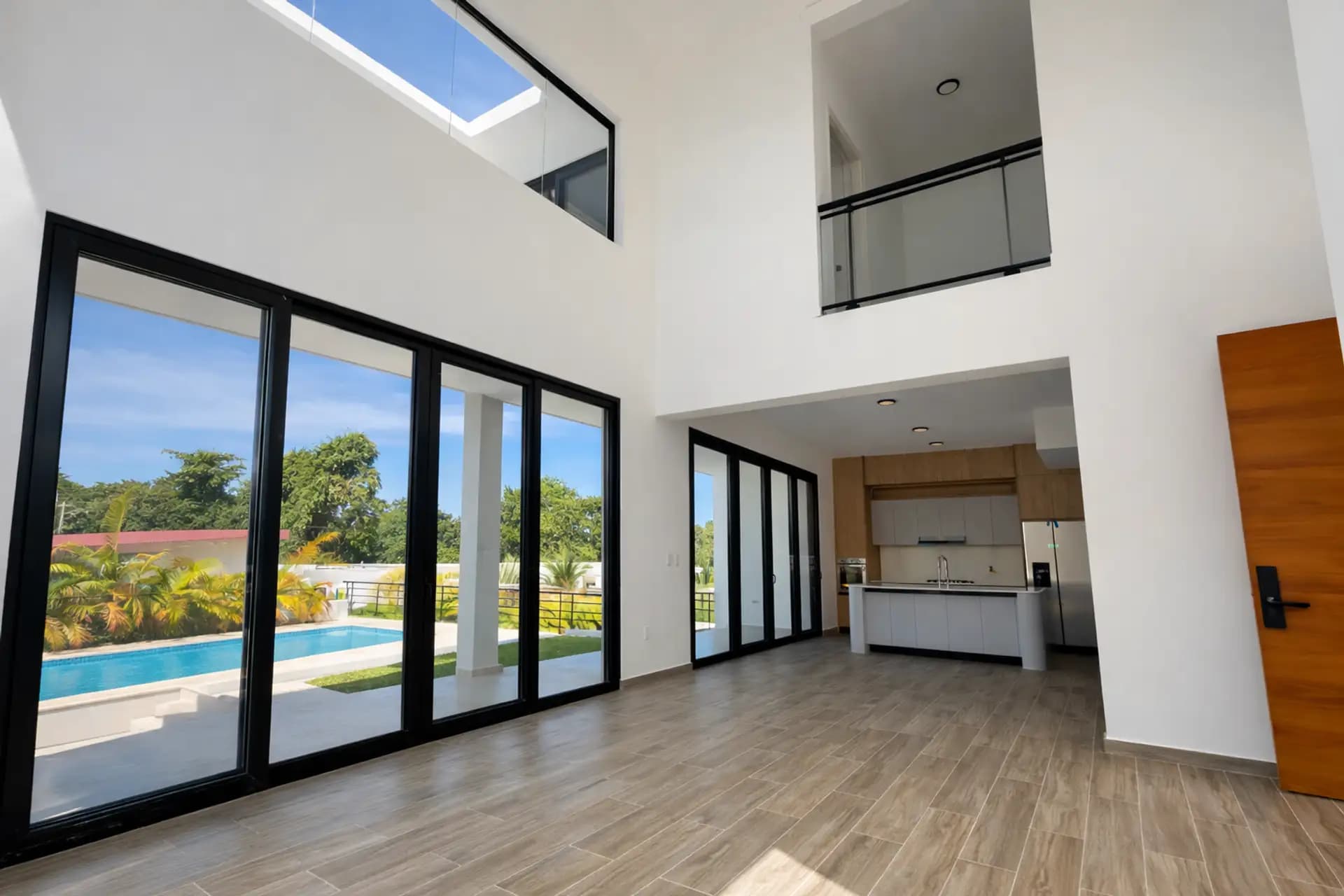 3-Bedroom New Pool Villa with Rooftop Terrace in Perla Marina — Open living & dining area