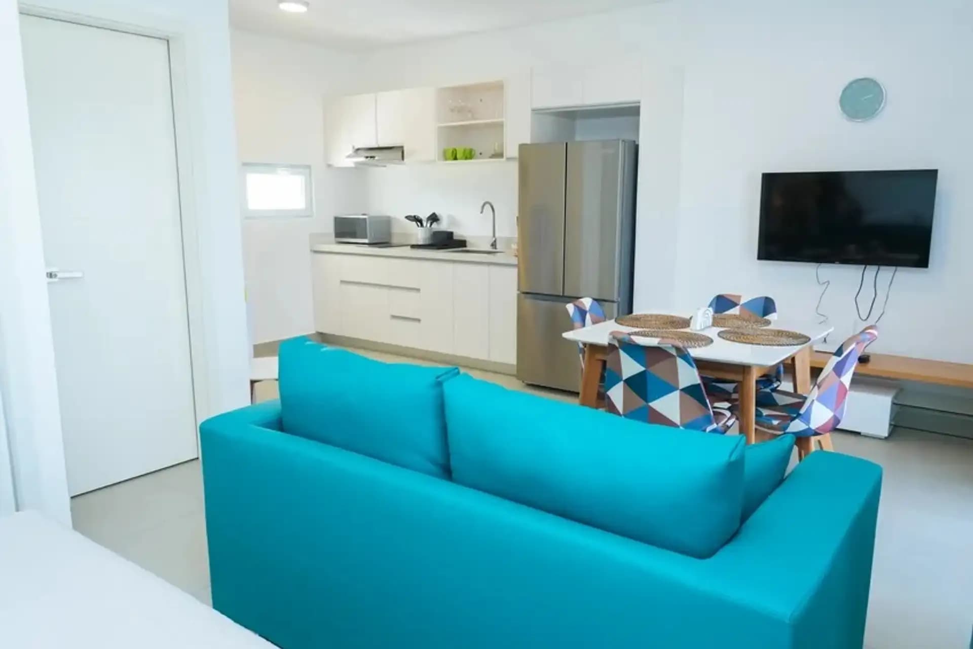 1-Bedroom Furnished Apartment with Shared Pool in Laguna City, Sosúa — Open living & dining area