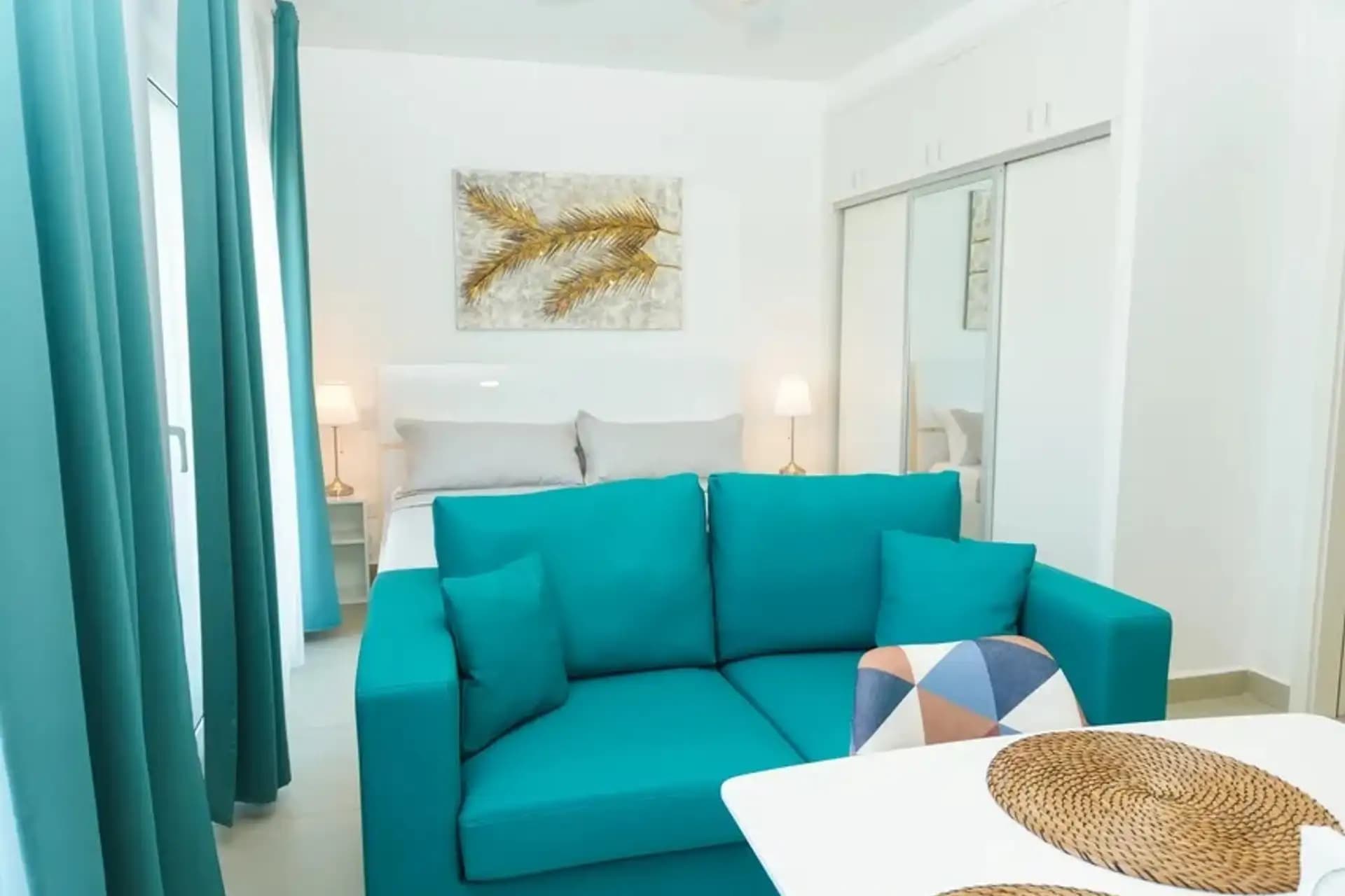 1-Bedroom Furnished Apartment with Shared Pool in Laguna City, Sosúa — Open living & dining area