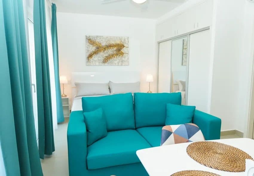 1-Bedroom Furnished Apartment with Shared Pool in Laguna City, Sosúa — Open living & dining area